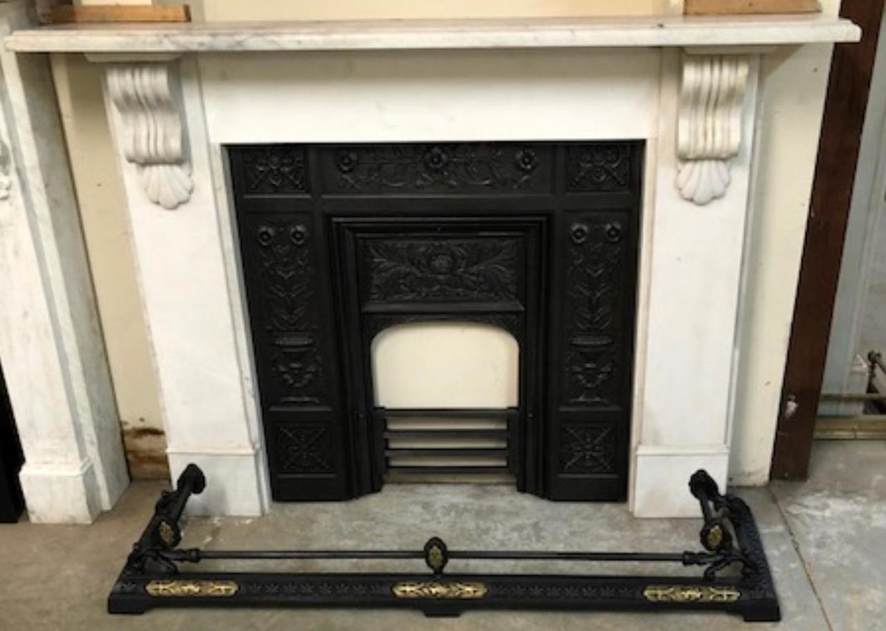 A Reclaimed Victorian Style Corbel Fire Surround In White Marble