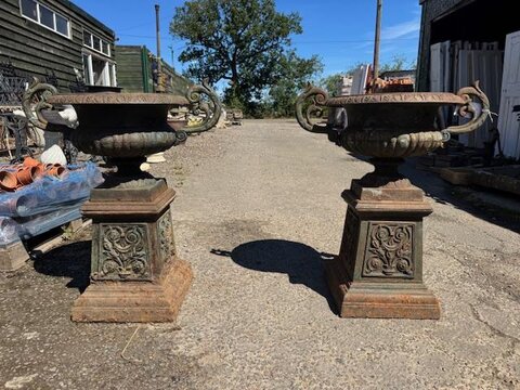 A pair of Regency style cast iron urns P1007